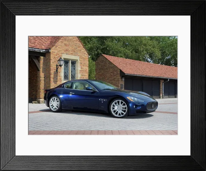 Framed Print : Front 3 / 4 static view of a blue 2010 Maserati GranTurismo in front of a private upscale garage Framed Print : Front 3 / 4 static view of a blue 2010 Maserati GranTurismo in front of a private upscale garage