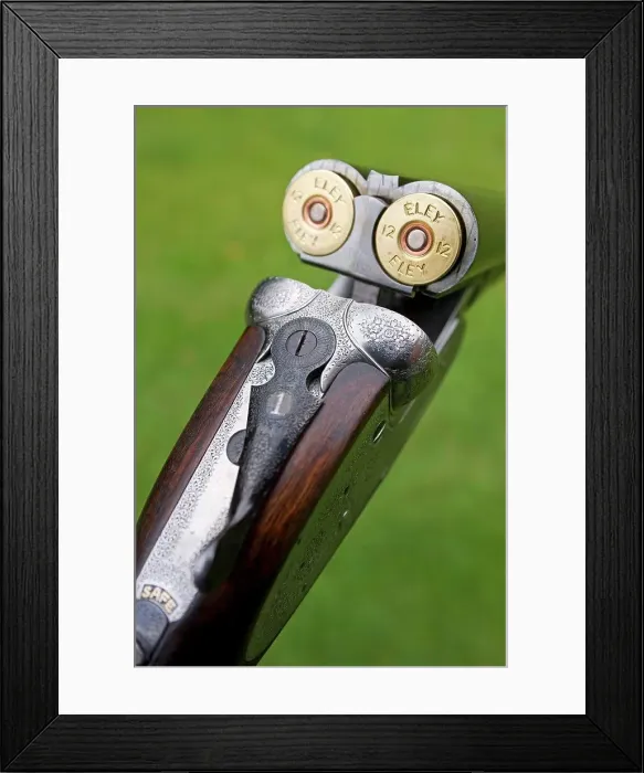 Framed Print : England; A fine side-by-side 12 bore shotgun made by premier English gunsmiths James Purdey and Sons