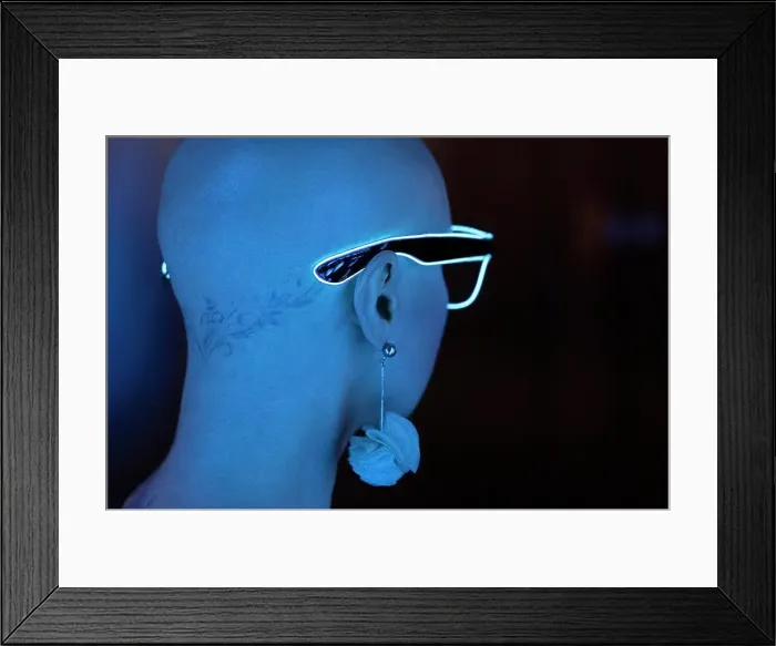 Framed Print : Portrait stylish woman with shaved head wearing neon eyeglasses