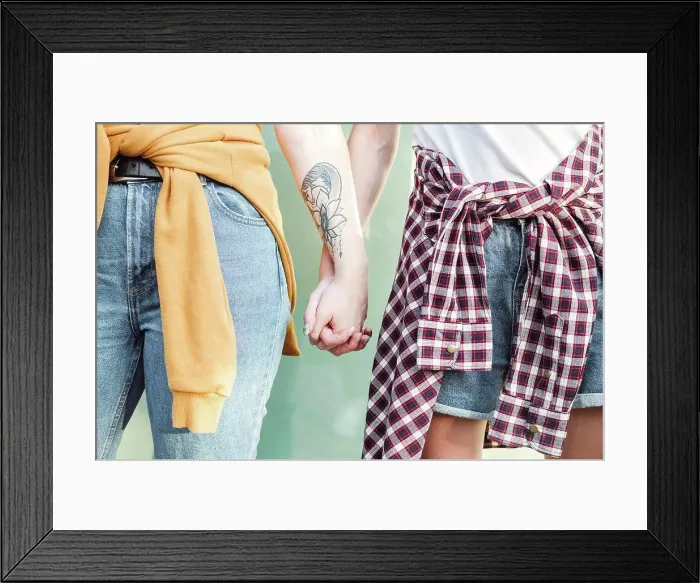 Framed Print : Female friends holding hands of each other Framed Print : Female friends holding hands of each other