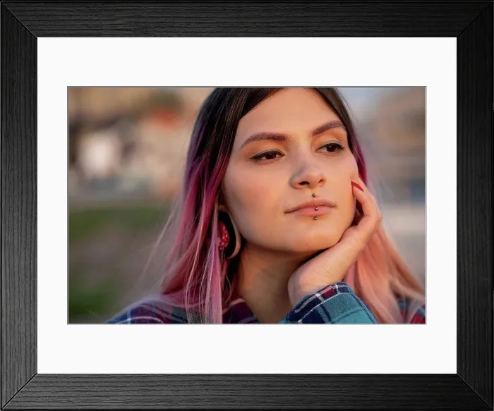 Framed Print : Hipster woman with hand on chin day dreaming outdoors Framed Print : Hipster woman with hand on chin day dreaming outdoors