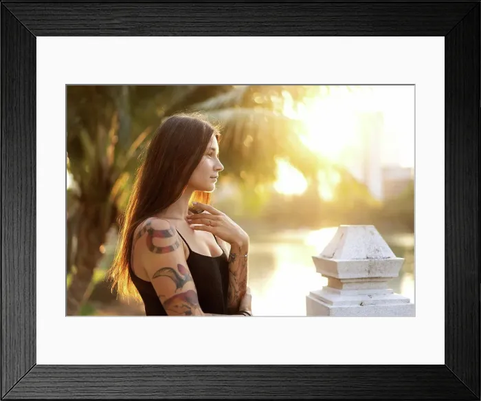 Framed Print : beautiful girl in tattoos among the palm trees at sunset