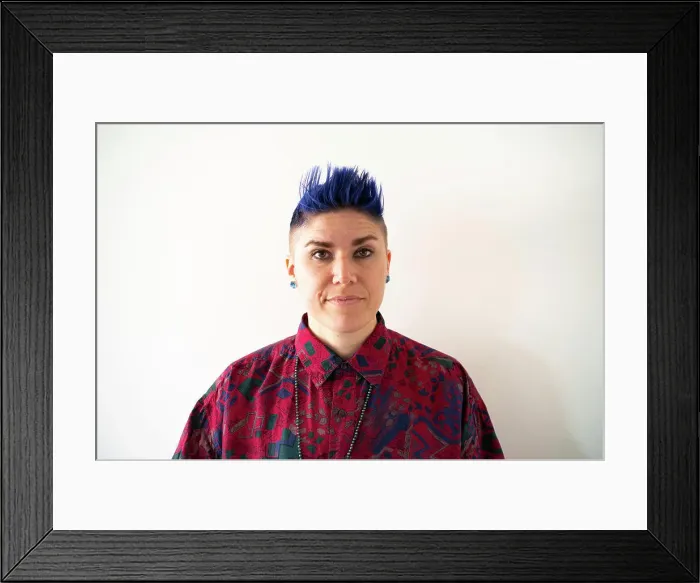 Framed Print : Studio portrait of smiling non-binary person Framed Print : Studio portrait of smiling non-binary person