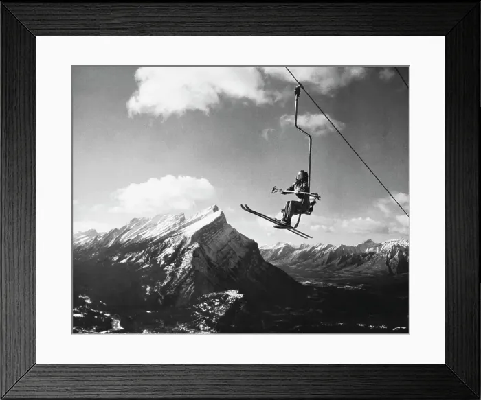 Framed Print : Skier sitting on a ski lift, Alberta, Canada Framed Print : Skier sitting on a ski lift, Alberta, Canada