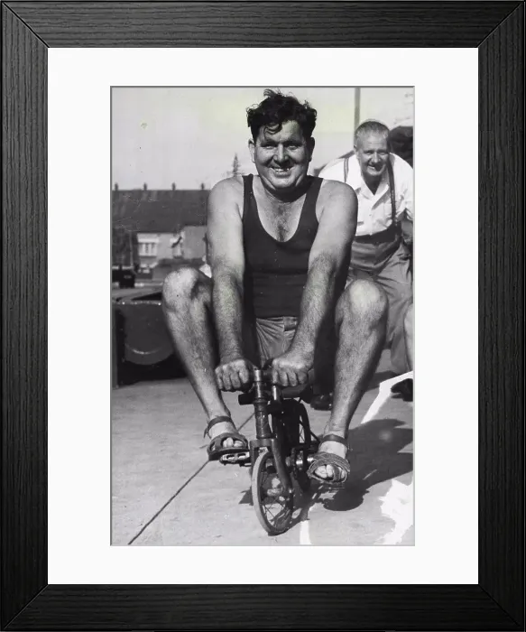 Framed Print : Publican George Lloyd training on a miniature bicycle for the publicans Cycle Derby to be held at Sydney Sports Ground