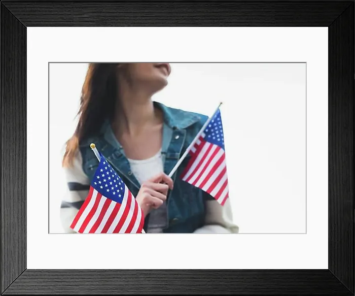 Framed Print : Young smiling lady holding american flags