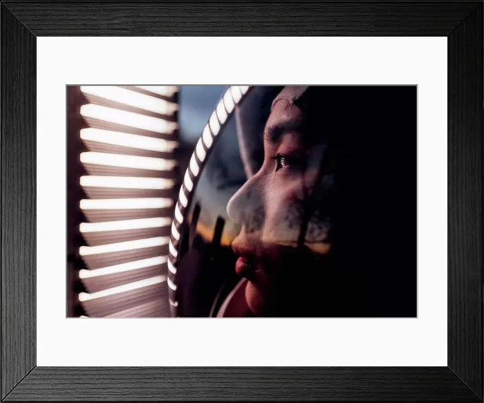 Framed Print : Female astronaut looking at illuminated lights while wearing space helmet Framed Print : Female astronaut looking at illuminated lights while wearing space helmet