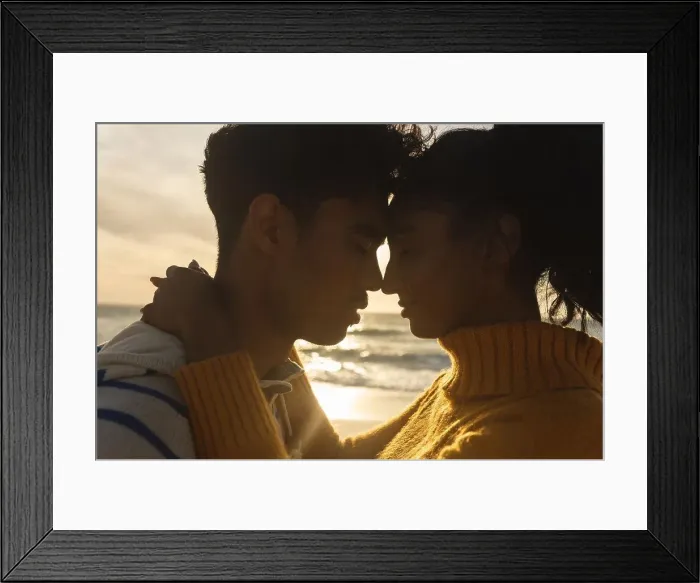 Framed Print : Side view of multiracial couple romancing while hugging each other at beach during sunset. lifestyle, love and weekend Framed Print : Side view of multiracial couple romancing while hugging each other at beach during sunset. lifestyle, love and weekend