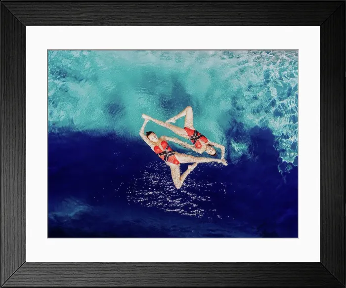 Framed Print : Aerial view of Caucasian synchronized swimmers