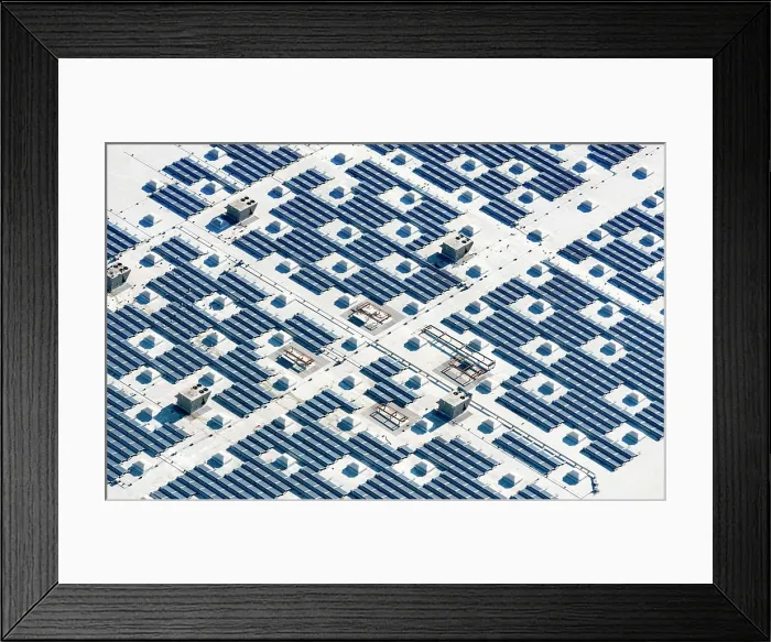 Framed Print : Aerial view of a solar farm, blue photovoltaic solar panels set out in a grid pattern Framed Print : Aerial view of a solar farm, blue photovoltaic solar panels set out in a grid pattern