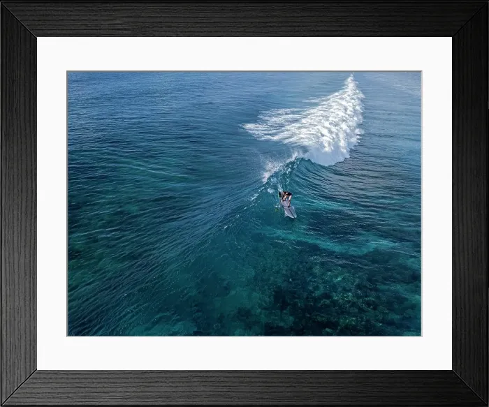 Framed Print : Aerial view of surfer in an ocean Framed Print : Aerial view of surfer in an ocean