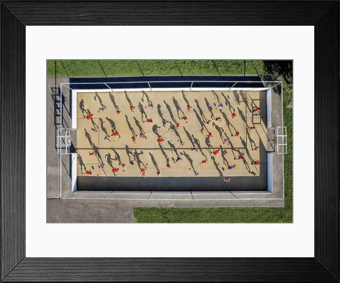 Framed Print : Male and female athletes playing basketball at sports court Framed Print : Male and female athletes playing basketball at sports court