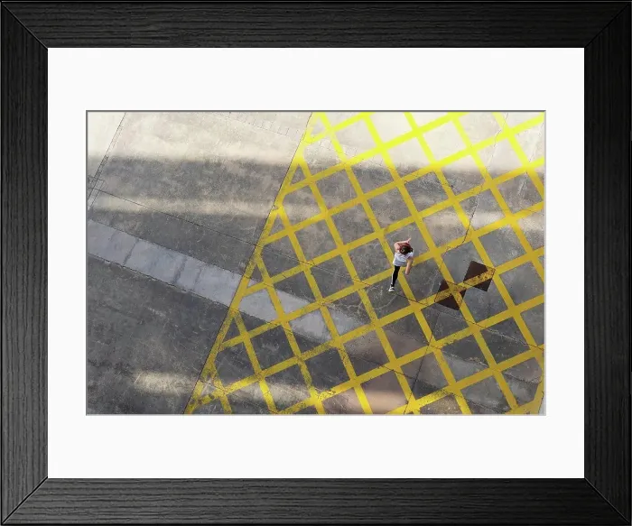 Framed Print : Female athlete jogging on road