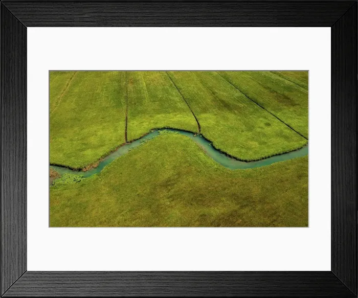 Framed Print : Drone view of Zeller Ache river flowing through green meadow Framed Print : Drone view of Zeller Ache river flowing through green meadow