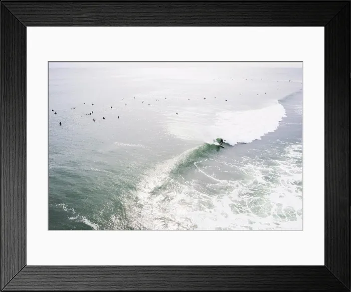Framed Print : Aerial of Surfers on long hurricane waves in Rhode Island