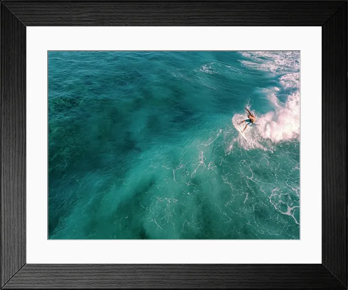 Framed Print : Aerial view of surfer on a wave