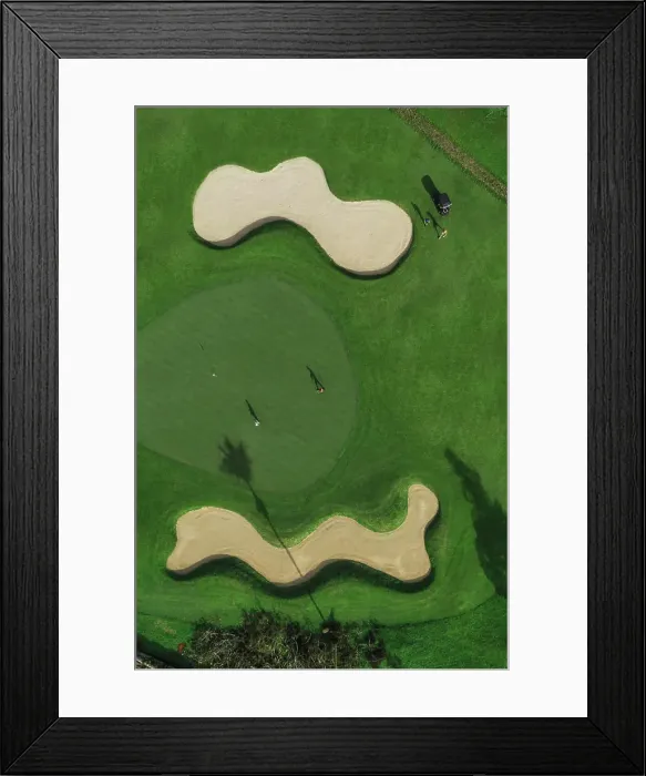 Framed Print : Aerial view of players at golf field