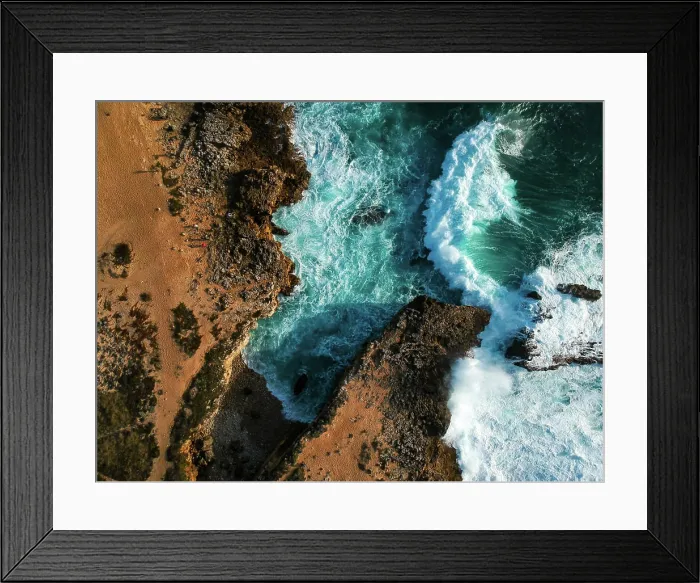 Framed Print : Aerial top view of sea waves hitting rocks on the beach with turquoise Framed Print : Aerial top view of sea waves hitting rocks on the beach with turquoise