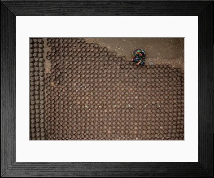 Framed Print : Manikgonj, Bangladesh - 20 February 2022: Aerial view of a woman working with clay pot in Manikgonj, Dhaka, Bangladesh Framed Print : Manikgonj, Bangladesh - 20 February 2022: Aerial view of a woman working with clay pot in Manikgonj, Dhaka, Bangladesh