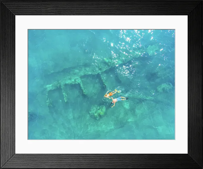 Framed Print : Aerial view of a couple snorkeling on shipwreck in the Gulf of California, Baja California Sur, Mexico Framed Print : Aerial view of a couple snorkeling on shipwreck in the Gulf of California, Baja California Sur, Mexico
