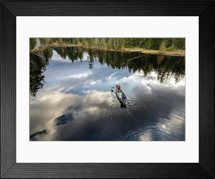 Framed Print : Aerial view of couple paddling canoe on lake in Maine woods Framed Print : Aerial view of couple paddling canoe on lake in Maine woods