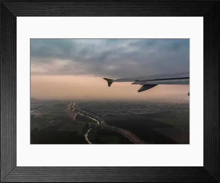 Framed Print : Airplane wing and aerial view of Punta Arenas city lights at dusk, Magallanes Region, Chile Framed Print : Airplane wing and aerial view of Punta Arenas city lights at dusk, Magallanes Region, Chile
