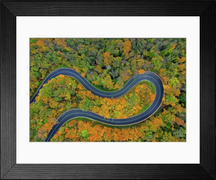 Framed Print : Aerial view over empty winding road, hairpin turn, hair pin bend running through forest showing autumn colours Framed Print : Aerial view over empty winding road, hairpin turn, hair pin bend running through forest showing autumn colours
