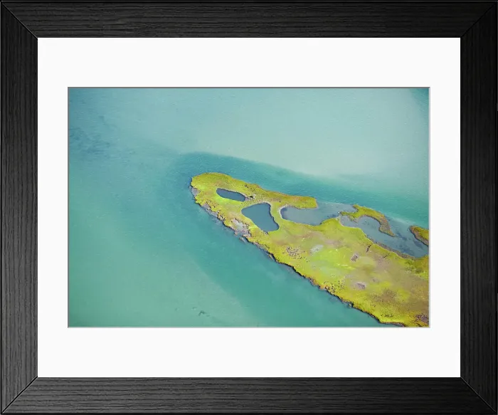 Framed Print : Aerial view of a serene turquoise waterbody with a lush green island Framed Print : Aerial view of a serene turquoise waterbody with a lush green island