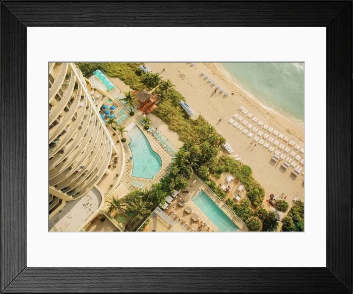 Framed Print : Aerial view of hotel pools and tropical beach Framed Print : Aerial view of hotel pools and tropical beach