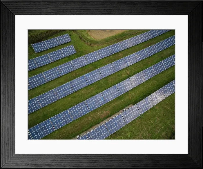 Framed Print : Aerial view of solar panels in field
