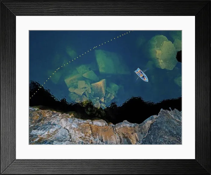 Framed Print : Aerial view of boat sailing¶ÿover marble boulders sunken in Marble Lake