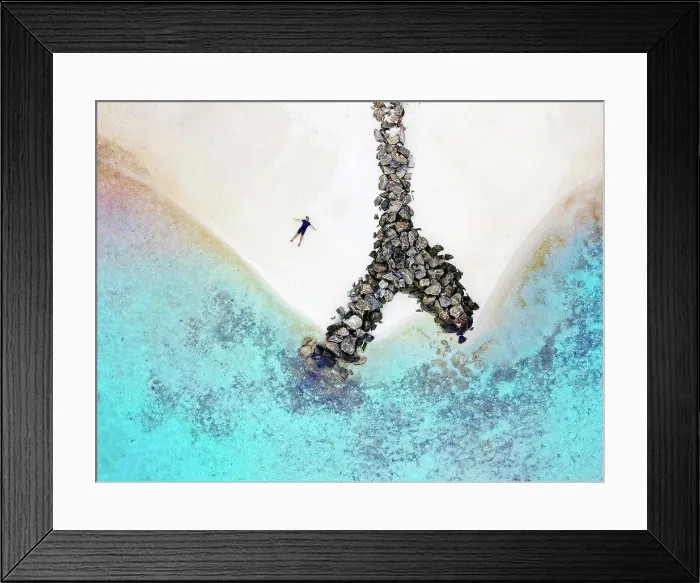 Framed Print : Maldives, Kaafu Atoll, Aerial view of man lying alone on sandy coastal beach of Huraa island Framed Print : Maldives, Kaafu Atoll, Aerial view of man lying alone on sandy coastal beach of Huraa island