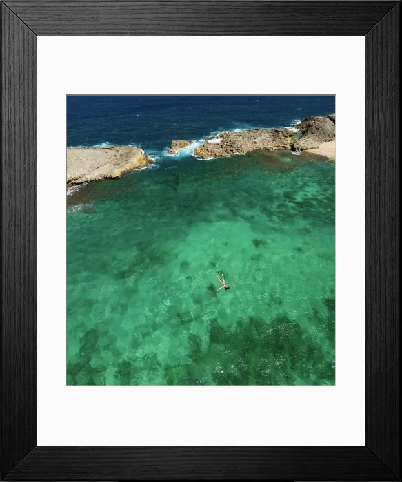 Framed Print : Aerial Shot of Girl Floating in Green Cove Framed Print : Aerial Shot of Girl Floating in Green Cove
