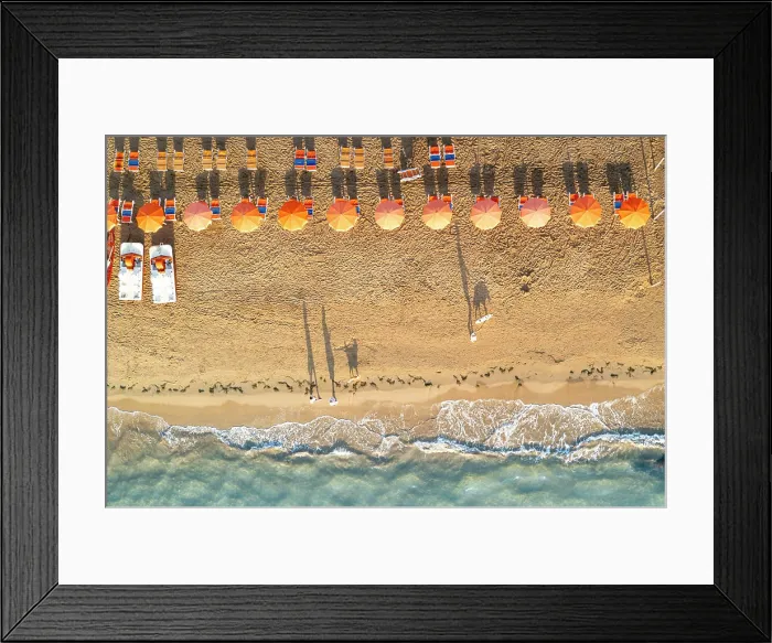 Framed Print : Aerial view of sunshades in a row on sand beach washed by the crystal sea