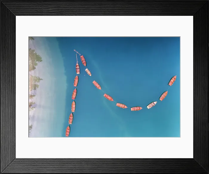 Framed Print : Boats in a row moored in the turquoise coloured water of Lake Braies (Pragser Wildsee) Framed Print : Boats in a row moored in the turquoise coloured water of Lake Braies (Pragser Wildsee)