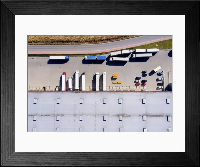 Framed Print : Aerial Shot of Truck with Attached Semi Trailer Leaving Industri Framed Print : Aerial Shot of Truck with Attached Semi Trailer Leaving Industri
