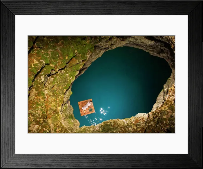 Framed Print : Aerial view of woman lying on wooden raft