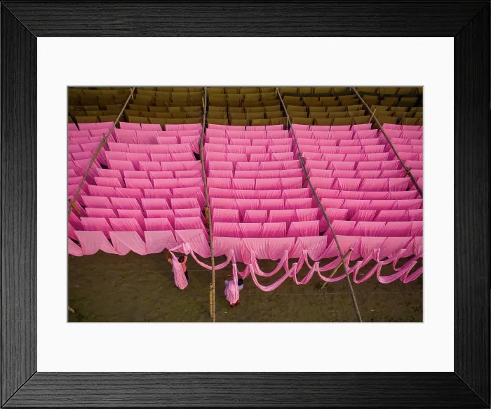 Framed Print : Aerial view of a person working in a public laundry hanging for drying colourful cloth in Narayanganj Framed Print : Aerial view of a person working in a public laundry hanging for drying colourful cloth in Narayanganj