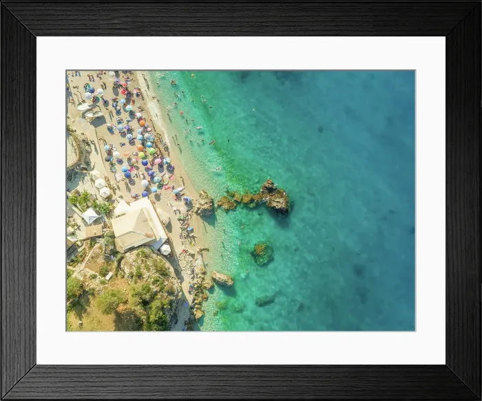 Framed Print : Aerial view of crowded beach with vacationers, parasols and resort, Lefkada, Greece Framed Print : Aerial view of crowded beach with vacationers, parasols and resort, Lefkada, Greece