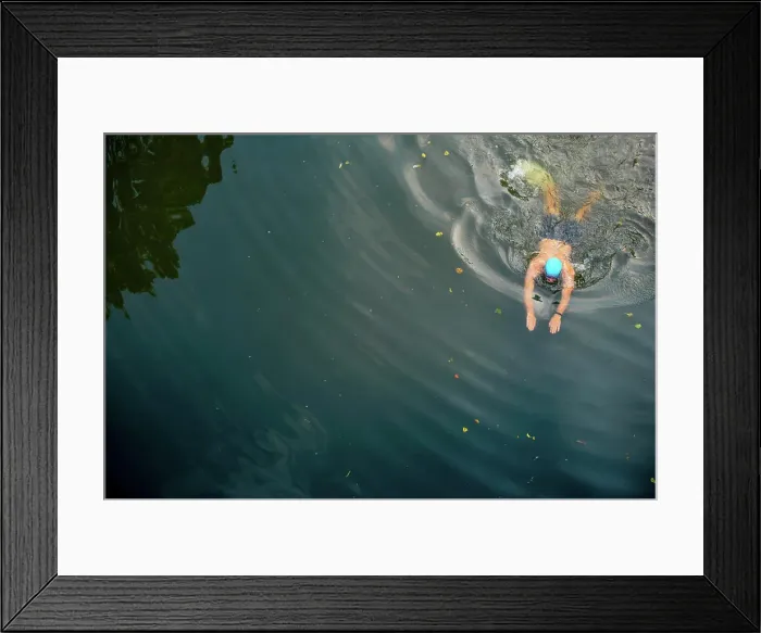 Framed Print : Swimmer gliding through tranquil waters Framed Print : Swimmer gliding through tranquil waters