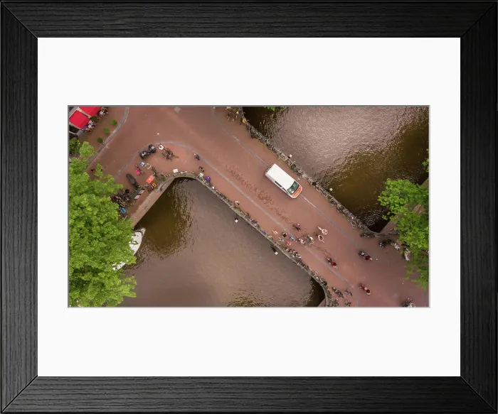 Framed Print : Aerial view of people cycling in Amsterdam city center, The Netherlands