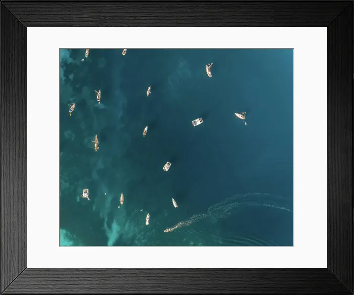 Framed Print : Aerial view of group of boats anchored in the mediterranean sea, Kastos island, Greece Framed Print : Aerial view of group of boats anchored in the mediterranean sea, Kastos island, Greece