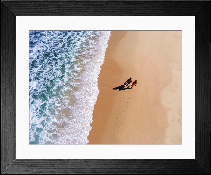 Framed Print : Aerial view of a couple carrying snorkeling gear walking on the beach, Gulf of California, Baja California Sur, Mexico Framed Print : Aerial view of a couple carrying snorkeling gear walking on the beach, Gulf of California, Baja California Sur, Mexico