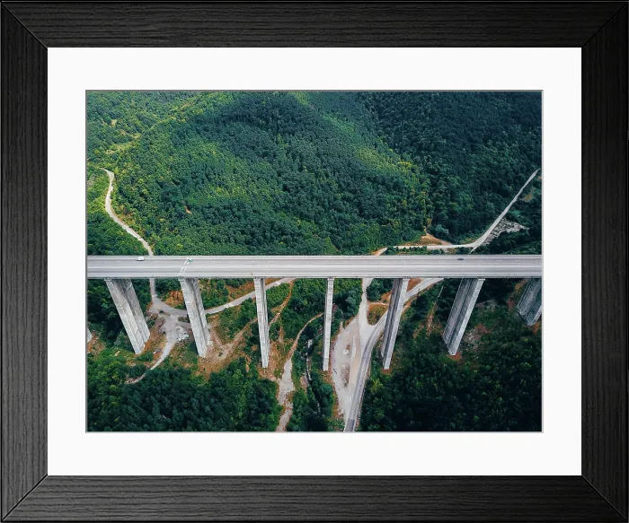 Framed Print : Aerial view of the road in the mountains over the bridge Aerial view of the road in the mountains over the bridge