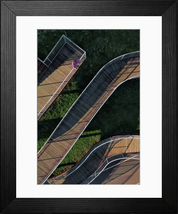 Framed Print : Russia, Aerial view of woman standing on winding boardwalk Framed Print : Russia, Aerial view of woman standing on winding boardwalk
