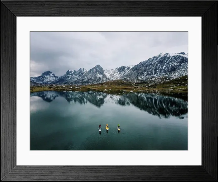Framed Print : Aerial view of three people stand up paddle surfing, Leon, Spain Framed Print : Aerial view of three people stand up paddle surfing, Leon, Spain