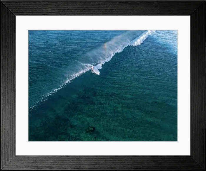 Framed Print : Aerial view of surfer in an ocean