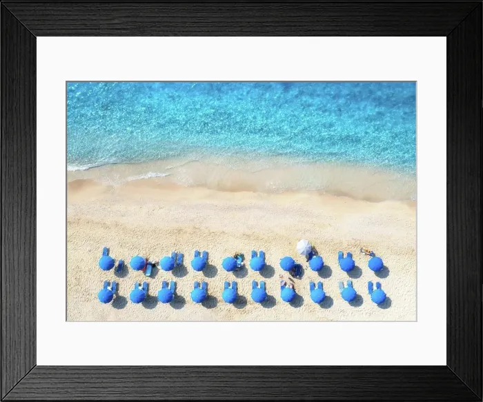 Framed Print : Aerial view of blue sea, sandy beach with sun beds and umbrellas at sunset in summer Framed Print : Aerial view of blue sea, sandy beach with sun beds and umbrellas at sunset in summer
