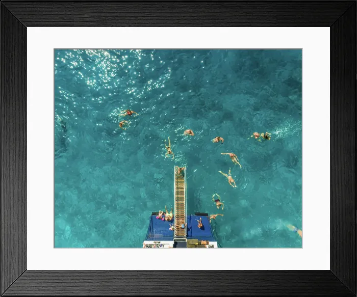 Framed Print : ITHAKI - GREECE, AUGUST 9 2018: Aerial view of people on ferry and swimming in sea, Ithaki island, Greece Framed Print : ITHAKI - GREECE, AUGUST 9 2018: Aerial view of people on ferry and swimming in sea, Ithaki island, Greece