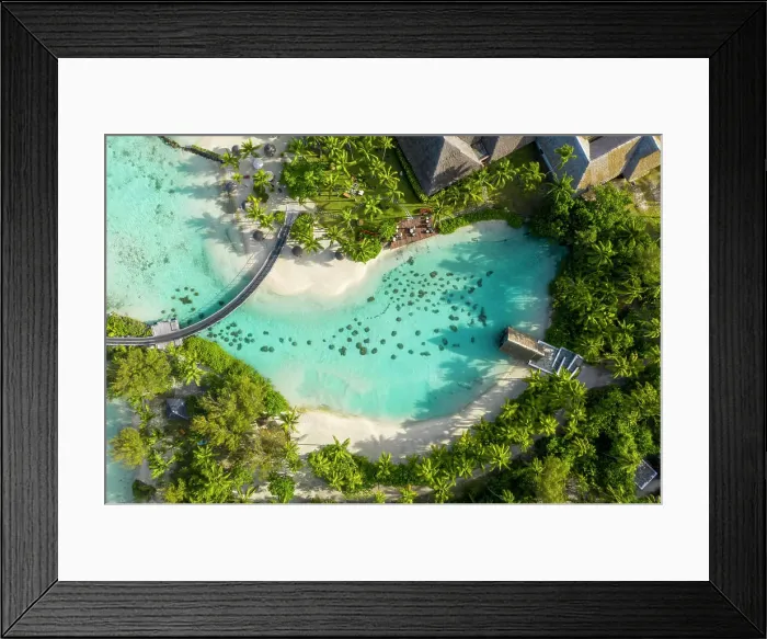 Framed Print : Aerial view of wooden huts from a luxury hotel along the reef in Tahiti, French Polynesia Framed Print : Aerial view of wooden huts from a luxury hotel along the reef in Tahiti, French Polynesia
